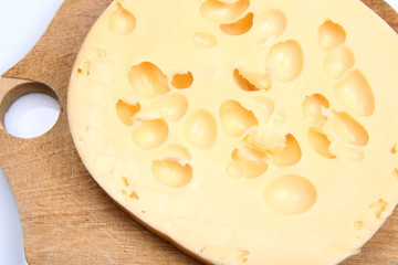 Cheese on a wooden board in close up