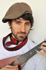 Funny young man with ukulele