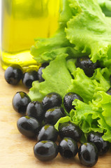 Black olives, greens and oil