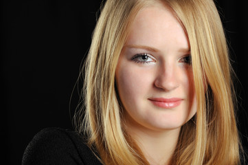 Fototapeta premium Portrait of the pretty young girl of the blonde