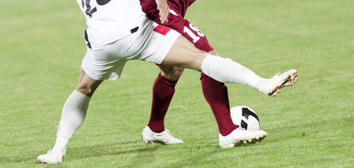 Obraz premium Soccer players running after the ball