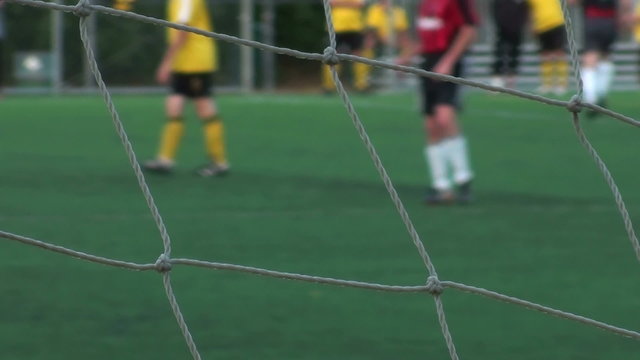 Soccer match through net - HD