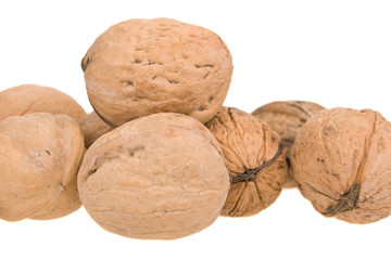 handful of walnuts on a white background