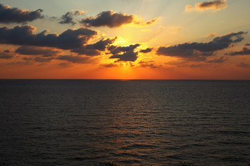 The sunset in the summer above sea