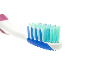 Closeup of toothbrush on white