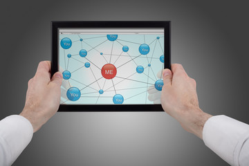 hands holding a touchpad pc and surfing in the social network