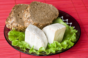 Camembert with bread on a plate