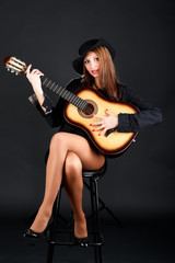 Fototapeta na wymiar Woman with guitar.