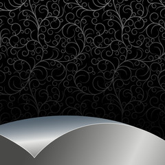 Black  background with flowers and leaves and silver sheet .