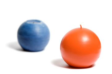 Blue and orange candle on a white isolated background
