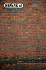 mermaid street brick wall background