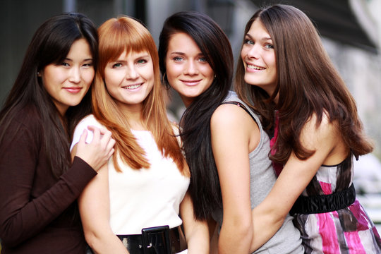 Close-up portrait of four urban women outside