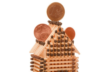 Euro coins on house