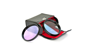 Small black case with filters on white background