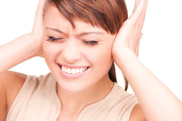 unhappy woman with hands on ears