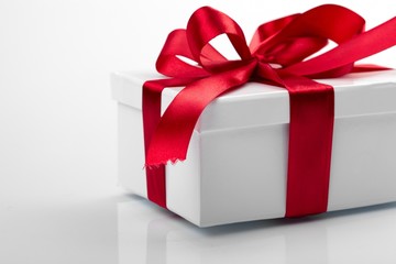 Gift decorated with a tape and a bow