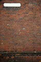 old fashioned street sign brick wall