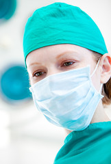 Assertive female surgeon before an intervention