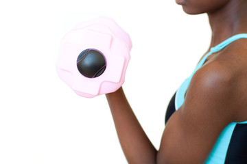Fototapeta premium Afro-american woman working out with dumbbell
