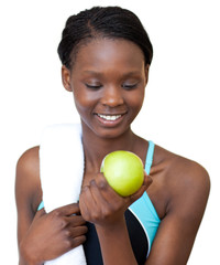 Fototapeta premium Young fitness woman eating an apple