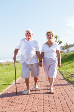 happy senior couple walking outdoors