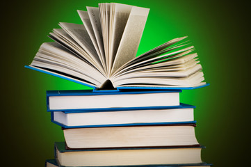 Stack of books against gradient background