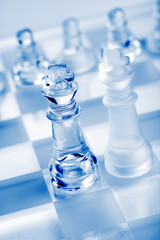 glass chess pieces with blue light