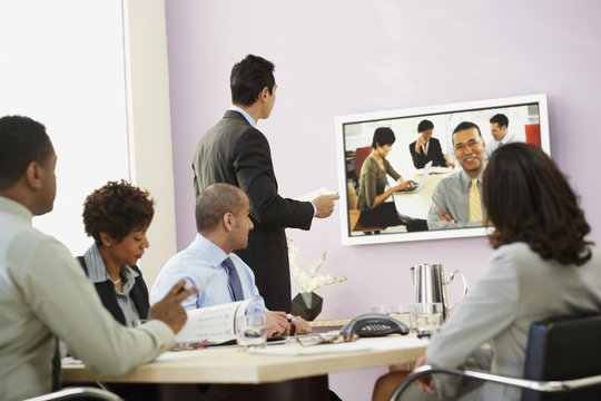 Multi-ethnic businesspeople having video conference