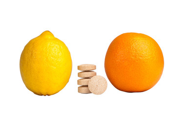 Tablets lemon and orange on white background