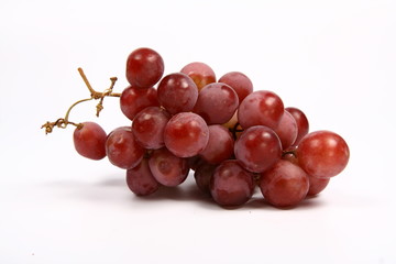 Red grapes on white background