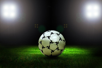 Soccer ball on the field of stadium with light