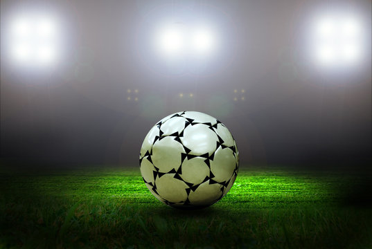 Soccer ball on the field of stadium with light