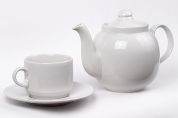 Little white tea cup and a kettle