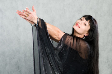 Obraz premium Beautiful woman of in a black dress