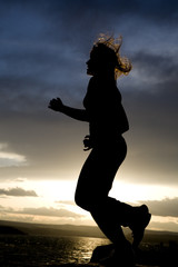 Fototapeta premium silhouette of a woman running