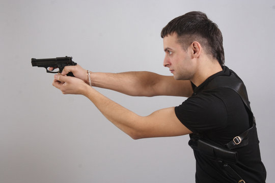 young man with a gun