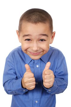 Smiling boy giving thumbs up sign, isolated on white