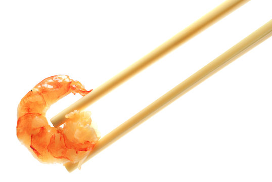 Prawn Asian style on chopsticks. Isolated