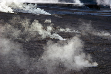 Steam rising from geyser field, Chile