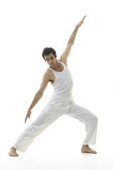 Young man yoga in the room