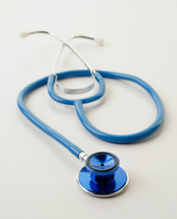 blue stethoscope on white
