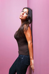 Woman leaning against a wall