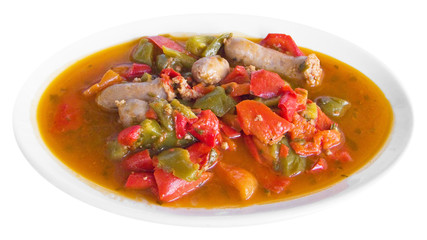 Sausages and Peppers in Tomato Sauce on white dish.