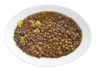 Lentils soup on white dish.