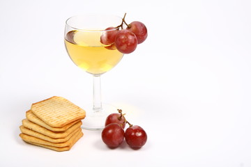 White wine,grapes,crackers on white with space for text