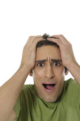 shy young man hiding his face in his hands