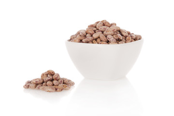 Pinto beans in a bowl isolated on a white background