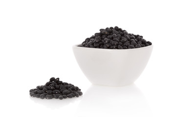 Fototapeta na wymiar Black turtle beans in a bowl isolated on a white background