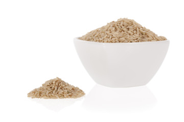 Brown rice in a bowl isolated on a white background