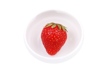 Fresh strawberry on white plate
